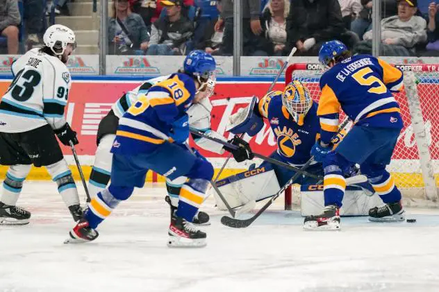 Saskatoon Blades' Vaughn Watterodt and Aidan De La Gorgendiere in action