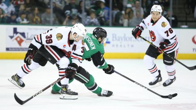 Rockford IceHogs' Luke Philp and Jakub Galvas battle Texas Stars' Oskari Laaksonen