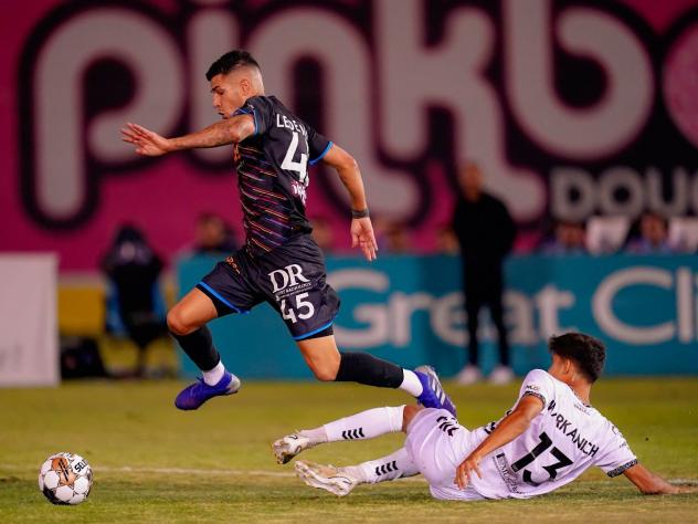 Las Vegas Lights FC's Emmanuel Ledesma battles Charleston Battery's Nick Markanich