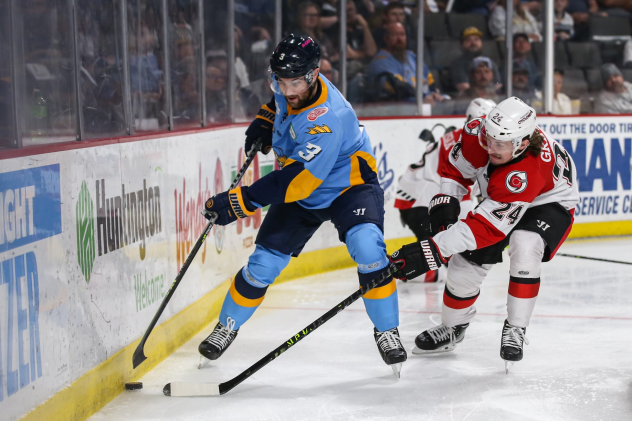 Toledo Walleye's Charlie Curti battles Cincinnati Cyclones' Lincoln Griffin