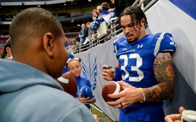St. Louis Battlehawks linebacker Tré Watson signs autographs