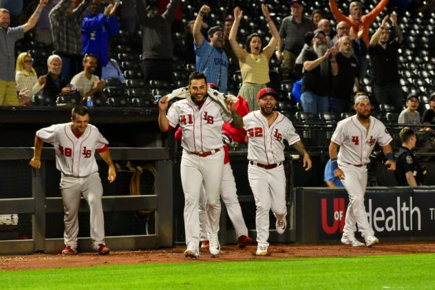 Louisville Bats exit the dugout following a victory