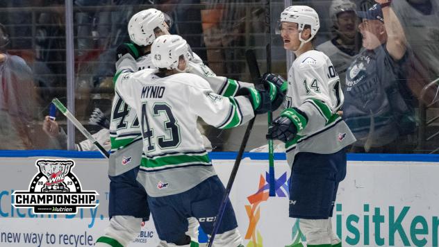 Seattle Thunderbirds' Sawyer Mynio, Lucas Ciona and Kevin Korchinski celebrate win
