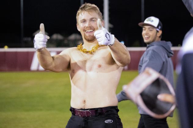 Shirtless Wisconsin Rapids Rafters catcher Levi Jensen after his walk-off hit