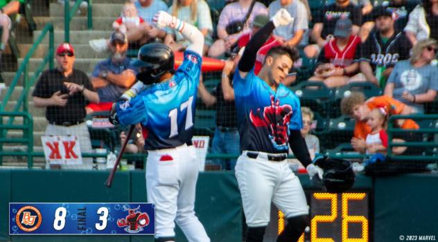 Hickory Crawdads' Keyber Rodriguez congratulates Cody Freeman
