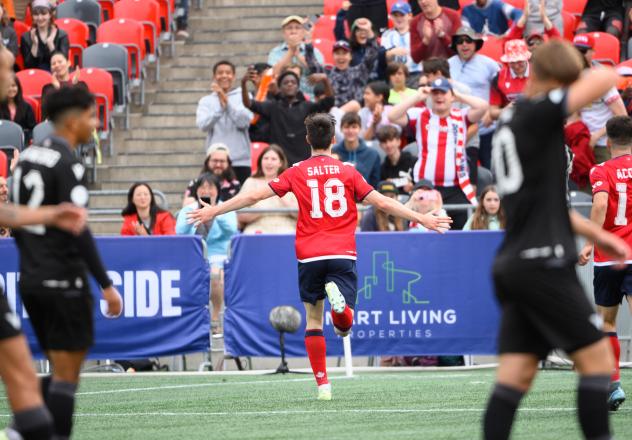 Samuel Salter of Atlético Ottawa reacts after his goal