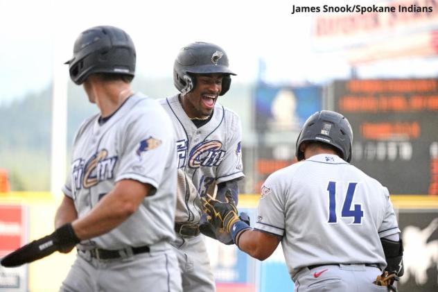 Tri-City Dust Devils shortstop Werner Blakely celebrates with teammates