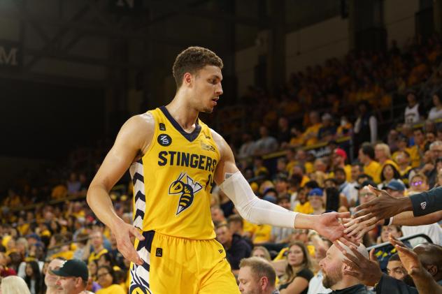 Edmonton Stingers' Brody Clarke greets fans
