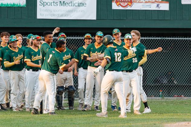 Sanford Mainers' Devin Russell congratulated by team