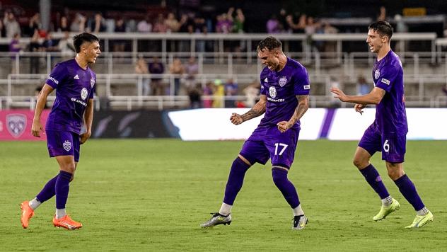 Louisville City FC's Ray Serrano, Cameron Lancaster and Wes Charpie celebrate win