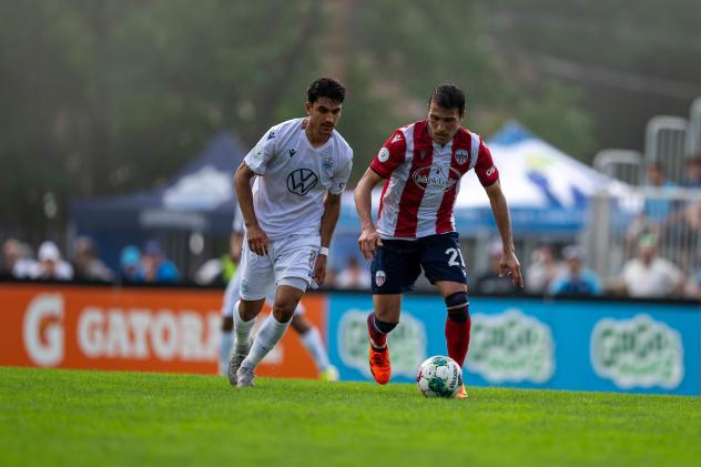 Atlético Ottawa midfielder Alberto Zapater Arjol (right) vs. Halifax Wanderers FC