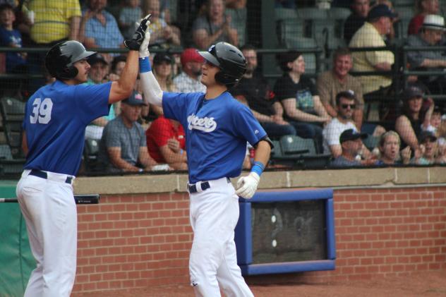 Evansville Otters' Aaron Beck congratulates Tim Holdgrafer