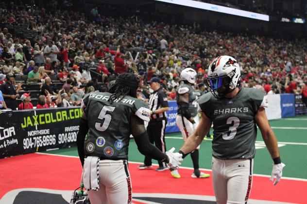 Jacksonville Sharks exchange handshakes