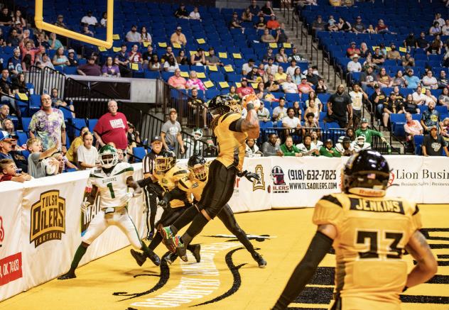 Tulsa Oilers linebacker Jordan Jones leaps for an interception
