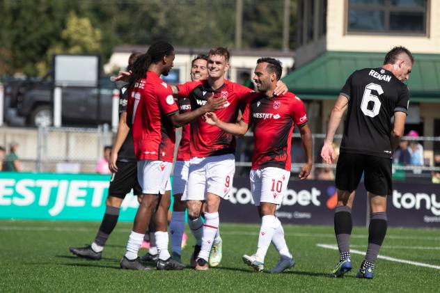Cavalry FC exchange congratulations following a goal