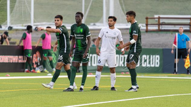 Lexington Sporting Club's Cesar Murillo Jr., Phila Dlamini and Phila Dlamini and Richmond Kickers' Zaca Moran on game day