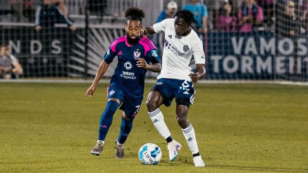 South Georgia Tormenta FC midfielder Mukwelle Akale (left)