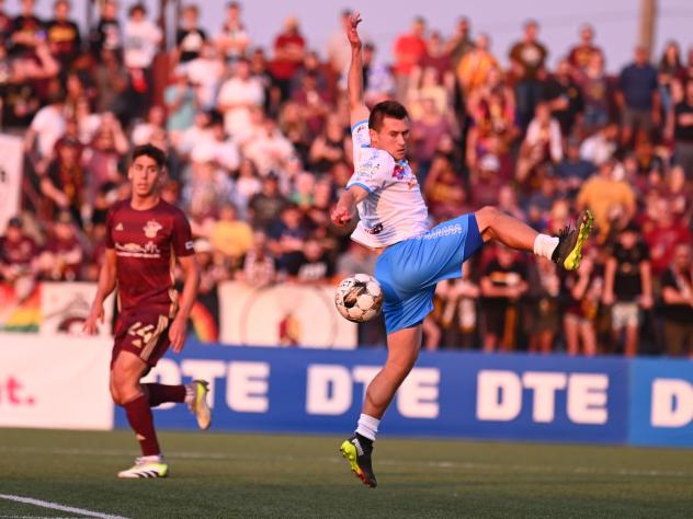 Las Vegas Lights FC and Detroit City FC on the field