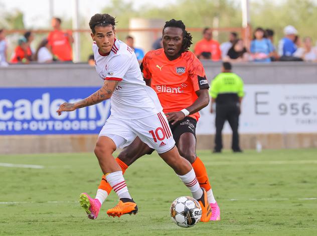 Phoenix Rising FC's Federico Varela and Rio Grande Valley Toros' Wahab Ackwei on the field