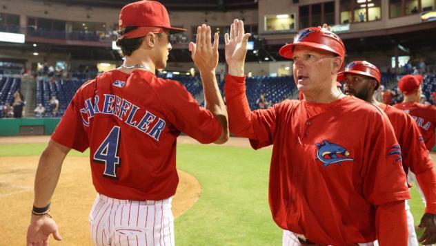 Clearwater Threshers exchange congratulations