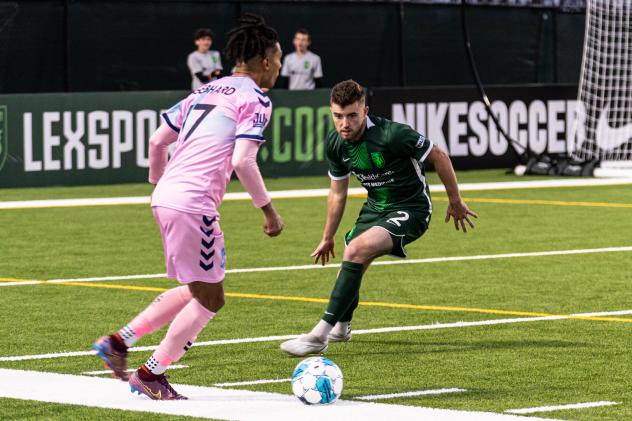 Lexington SC defender Tate Robertson (right) vs. Forward Madison