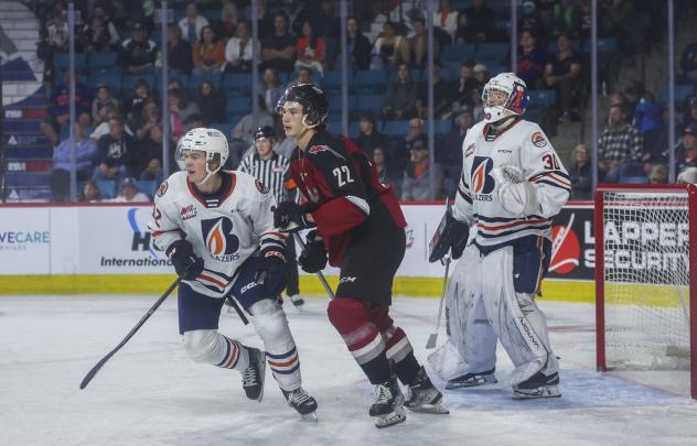 Vancouver Giants' Tyler Thorpe and Kamloops Blazers' Ryan Michael and Matthew Kieper on game night