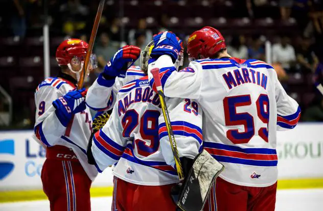 Kitchener Rangers celebrate with goaltender Tristan Malboeuf