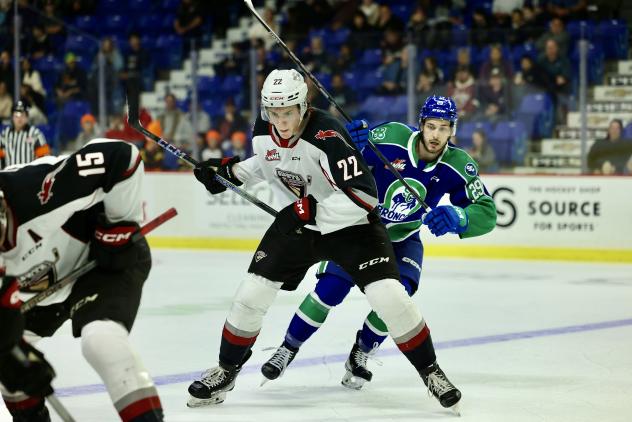 Vancouver Giants' Tyler Thorpe and Swift Current Broncos' Van Eger in action