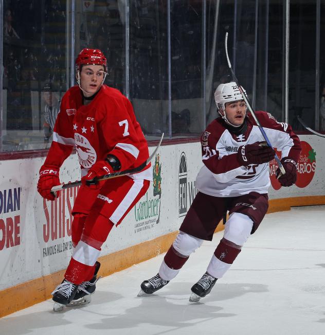 Peterborough Petes centre Tommy Purdeller (right) vs. the Soo Greyhounds