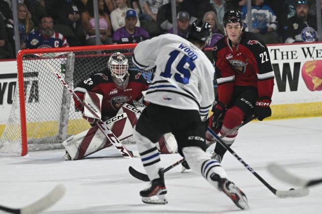 Wenatchee Wild's Briley Wood and Vancouver Giants' Brett Mirwald and Tyler Thorpe on game night