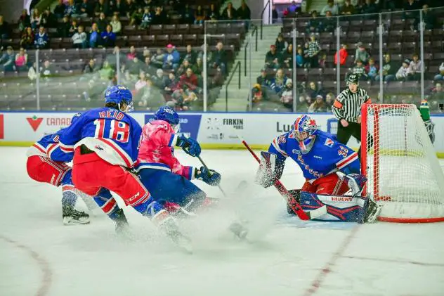 Kitchener Rangers' Cameron Reid and Jackson Parsons in action