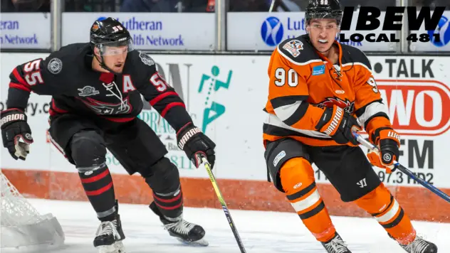 Indy Fuel's Christopher Cameron and Fort Wayne Komets' Xavier Cormier on the ice