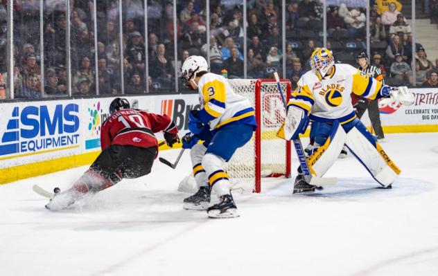 Red Deer Rebels' Frantisek Formanek and Saskatoon Blades' Jordan Martin in action