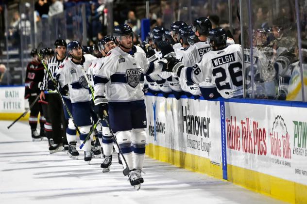 Worcester Railers exchange high fives along the bench