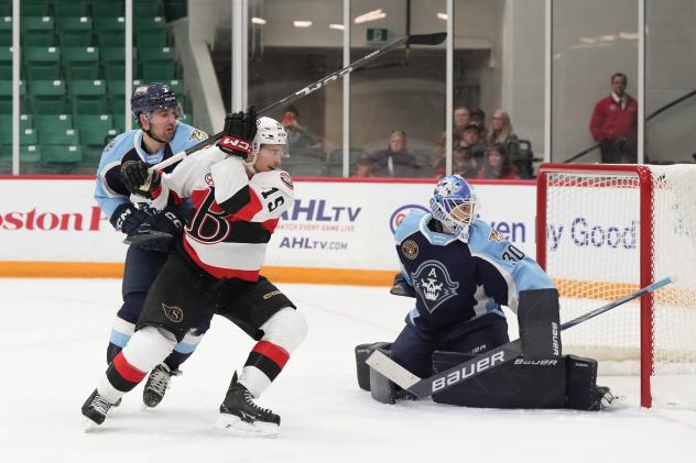 Belleville Senators' Matthew Highmore and Ottawa Senators' Yaroslav Askarov on game night