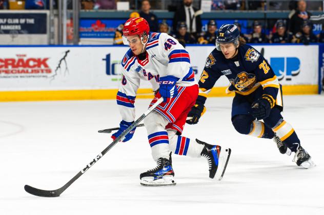 Kitchener Rangers' Filip Mesar and Erie Otters' Alexis Daviault in action