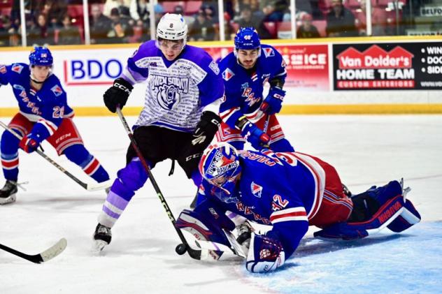 Kitchener Rangers goaltender Jackson Parsons dives on a loose puck vs. the Owen Sound Attack