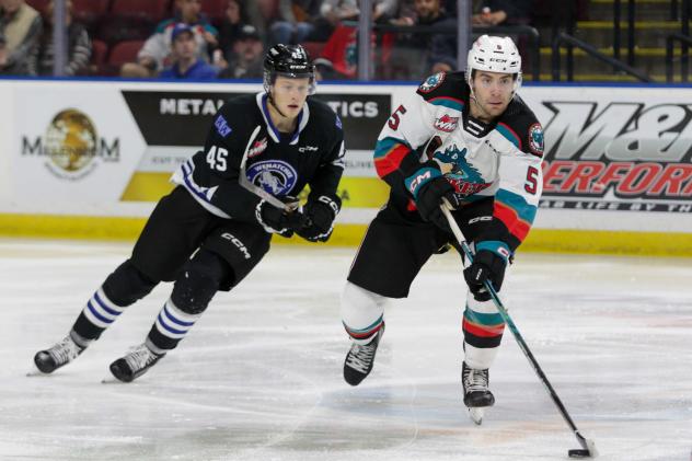 Wenatchee Wild's Steven Arp and Kelowna Rockets' John Babcock in action