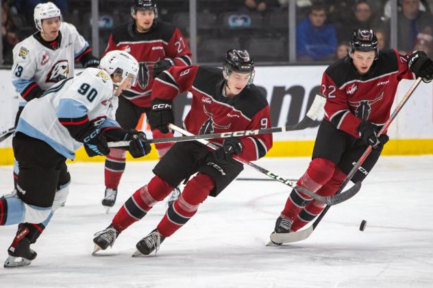 Red Deer Rebels centre Matthew Gard and right wing Dwayne Jean, Jr. (far right)