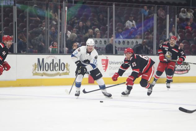 Cleveland Monsters' Owen Sillinger battles Grand Rapids Griffins' Dominik Shine