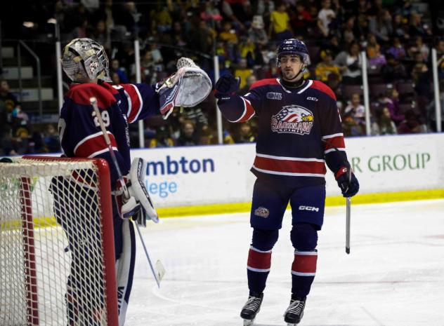 Saginaw Spirit exchange fist bumps