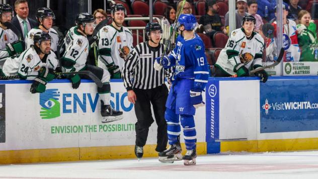 Wichita Thunder forward Bradley Marek exchanges pleasantries with the Utah Grizzlies