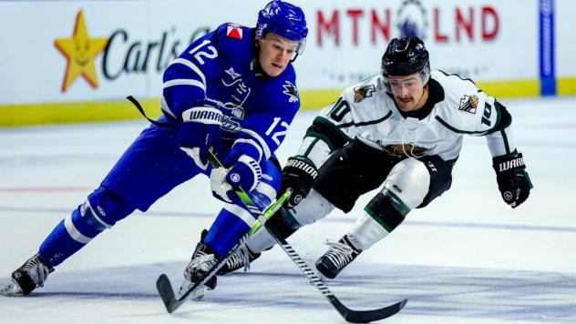 Wichita Thunder's Peter Bates and Utah Grizzlies' Mick Messner in action