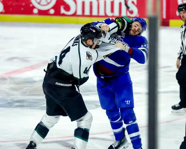 Utah Grizzlies' Cory Thomas grapples with the Witchita Thunder on game night