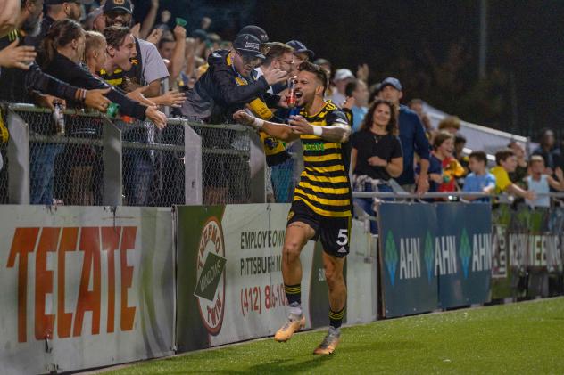 Pittsburgh Riverhounds SC center back Arturo Ordoñez celebrates with the crowd