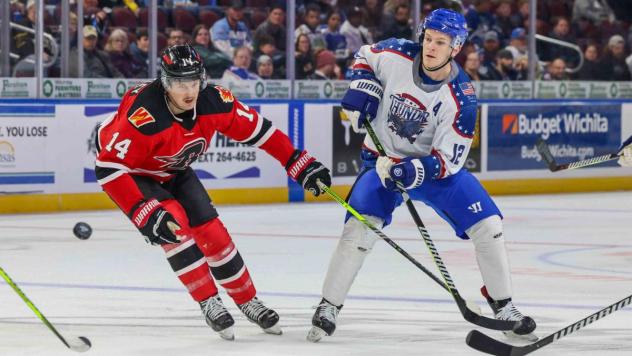 Rapid City Rush's Conner Bleackley and Wichita Thunder's Peter Bates in action