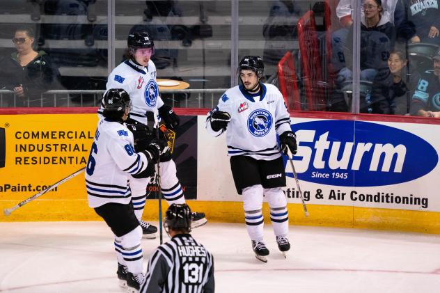 Wenatchee Wild's Kenta Isogai, Conor Geekie, and Matt Savoie on the ice