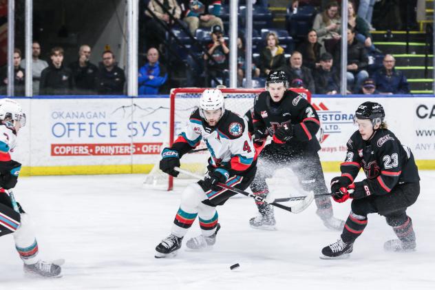 Kelowna Rockets defenceman Caden Price eyes the puck