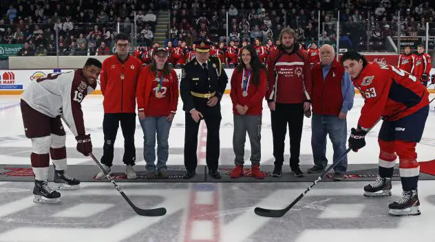 Peterborough Petes' Donovan McCoy and Windsor Spitfires' Roberto Mancini on Special Olympics Ontario and Law Enforcement Torch Run night
