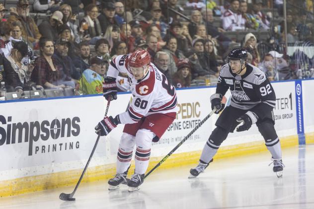 Rapid City Rush's Jarrod Gourley and Idaho Steelheads' Mark Rassell on the ice